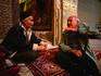 Two carpet dealers in Shiraz work out a deal