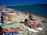 Sunbathers lap up the sun on Mar Bella beach in Barcelona.