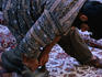 A man stretching new carpets in the bazaar area