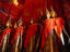 Standing Buddha statues draped in saffron, in the royal funerary carriage house, Wat Xieng Thong- Luang Prabang, Laos