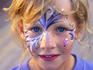 Girl with painted face at Rusty's Market.