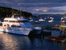 Whale watching ship and lobster boats moored at Bar Harbor.