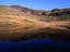 The calm waters of Llyn Ffridd ( lake ) reflect Y-Bwlch ( mountain ), Snowdonia National Park- Wales