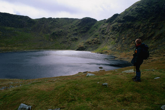 Beneath the summit of Helvellyn, enclosed in the arms of Striding Edge and Swirral Edge, is Red Tarn, possibly one of the best known tarns in The Lake District