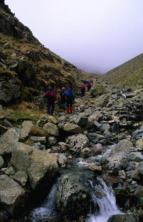 Climbing up How Beck waterfall to Scafell summit in The Lake District National Park.
