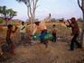 Boys practising rodeo skills on 44 gallon drum.