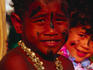 A young boy on the Polynesian float in the Festival of Darwin's grand parade. The August celebration is mainly an outdoor arts and culture festival that highlights Darwin's unique combination of large Asian and Aboriginal populations.