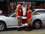Could almost be a scene from a Carl Hiaasen novel: Santa Claus and his little helpers arrive in South Beach