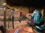 A seated weaver in his open air workshop at Mopti.