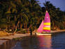 Sail boat on beach.