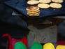 Pancakes cooking and for sale in a street market in Belize City.