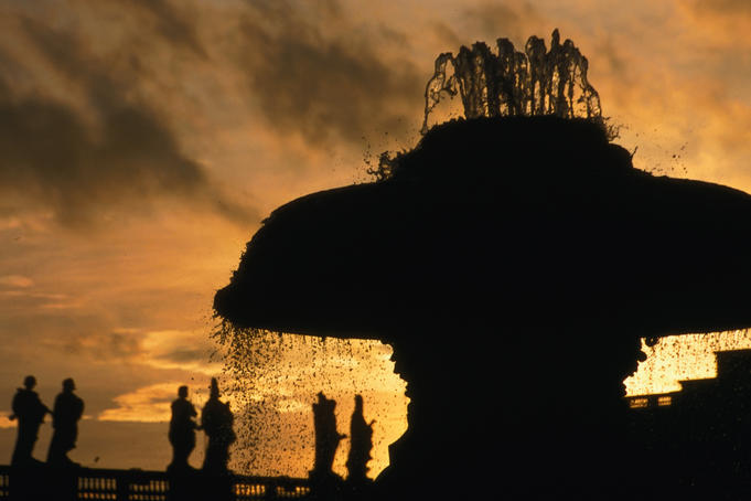 Silhouette of fountain by Carlo Moderno with statues of saints by Bernini, St Peter' s Square.