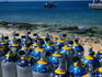 Diver oxygen tanks lined up on Cozumel beach.