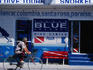 A cyclist rides past the Studio Blue dive centre in Cozumel.