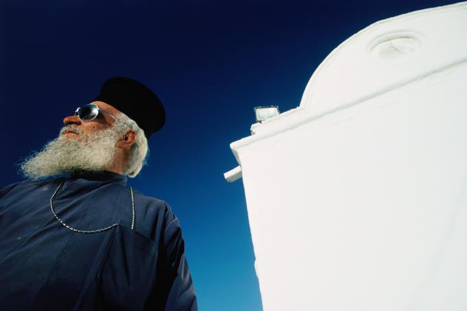 Greek Orthodox priest in sunshine.