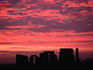 A dramatic sunrise over prehistoric Stonehenge, a ring of stones built over a 1500-year period