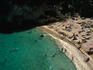 Looking down at sun-lovers on Macarelleta beach, Menorca Island