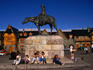 Relaxing beneath an equestrian statue of General Roca in the central plaza, which features log-and-stone buildings by architect Ezequiel Bustillo.