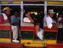Passengers ready to take a ride on this well-ventilated local bus.