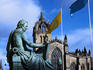 The Hume statue and St Giles Cathedral in Edinburgh, the cathedrals crown spire was completed in 1495