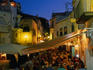 Crowded outdoor eateries in Old Town.