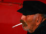 Fisherman smoking cigarette.