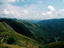 River flowing through rolling hills.