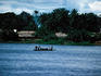 A crowded pirogue ferrying passengers across the Banalia River, Banalia.