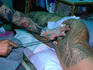Horiyoshi III, the master tattooist, performs the rare art of tebori (hand tattoing). This man's tattoos will cost at least US$10,000.