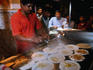 Cooking up the dosa entails spooning up the ghee onto the rice flour mix and mixing in other (secret) ingrediants, a specialty of the Camp Dosa shop, a fair way out of Bangalore but worth the trip