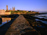 Early morning on the pier looking towards the harbour, Cathedral and Castle of St Andrews.