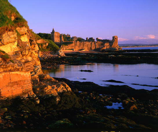 Ruins of St Andrews Castle at dawn.