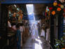 A shaft of light illuminates a local in an alleyway in Chandni Chowk in Old Delhi