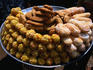 Tray of sweets from the Old Town of Hyderabad, from the left are laddus, in the middle are kajur and on the right are badusha