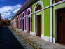 Brilliantly coloured houses on the cobblestoned street leading to Calle (street)Virtud.