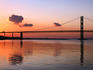 Forth Road Bridge reflected in the Firth of Forth at sunset, South Queensferry.