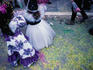 Children on the confetti-strewn street at Viareggio's Carnivale.