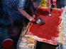 Village women following the traditional method of preparing tomato sauce for bottling - Isole Eolie (Aeolian Islands).