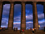 Parthenon National Monument on Calton Hill swarming with tourists in the evening sun, Edinburgh