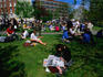 Students taking their lunch break in a park along the Grand Canal.
