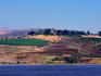 View of the Church of the Mount of Beatitudes, the place where it is believed Jesus gave the Sermon on the Mount, the Sea of Galilee is in the foreground - The Galilee