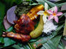 Traditional meal with fragipani's served on banana leaves from the Cook Island.