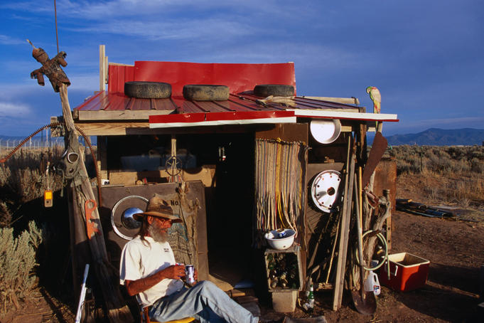 'Cowboy' sitting outside his shack in Taos.