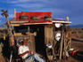 'Cowboy' sitting outside his shack in Taos.