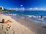 Sunbathing and swimming at Waikiki Beach in Honolulu.