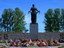 Statue of Mother Russia laying a garland of flowers in the Piskarov Cemetery in St Petersburg.