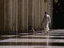 A worshipper walks the halls of the highly polished Mosque of Al-Hakim in Cairo