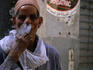 A local man enjoys a cheroot in the back streets of Central Cairo