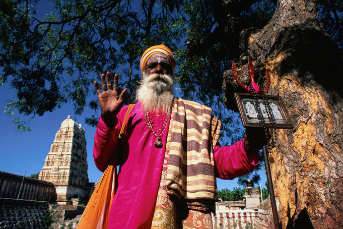 A Sadhu standing under a tree - Hampi, Karnataka