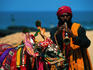 A fortune teller, Shankar, and his cow, Sita - Goa